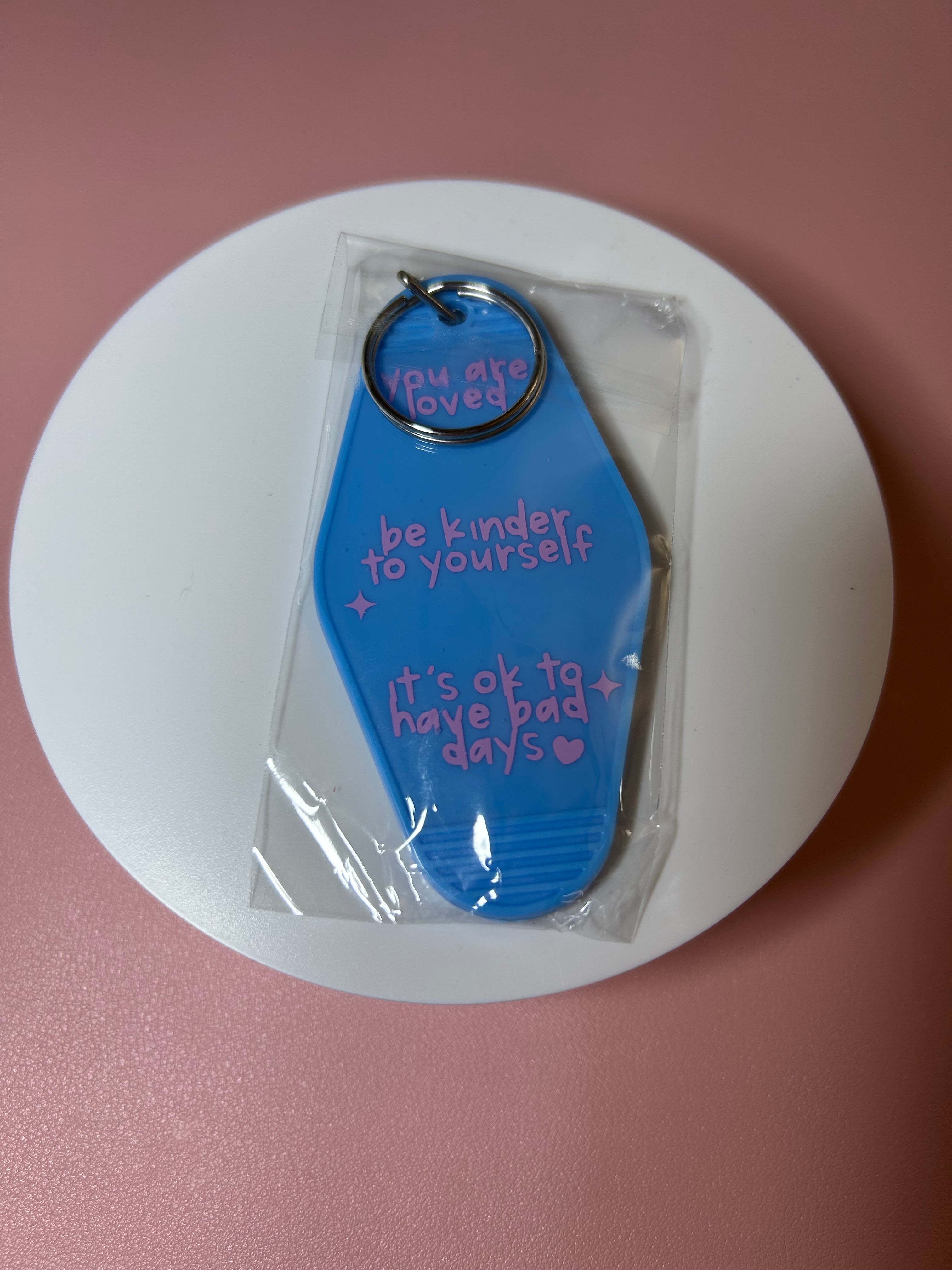 Double sided motel keychain
