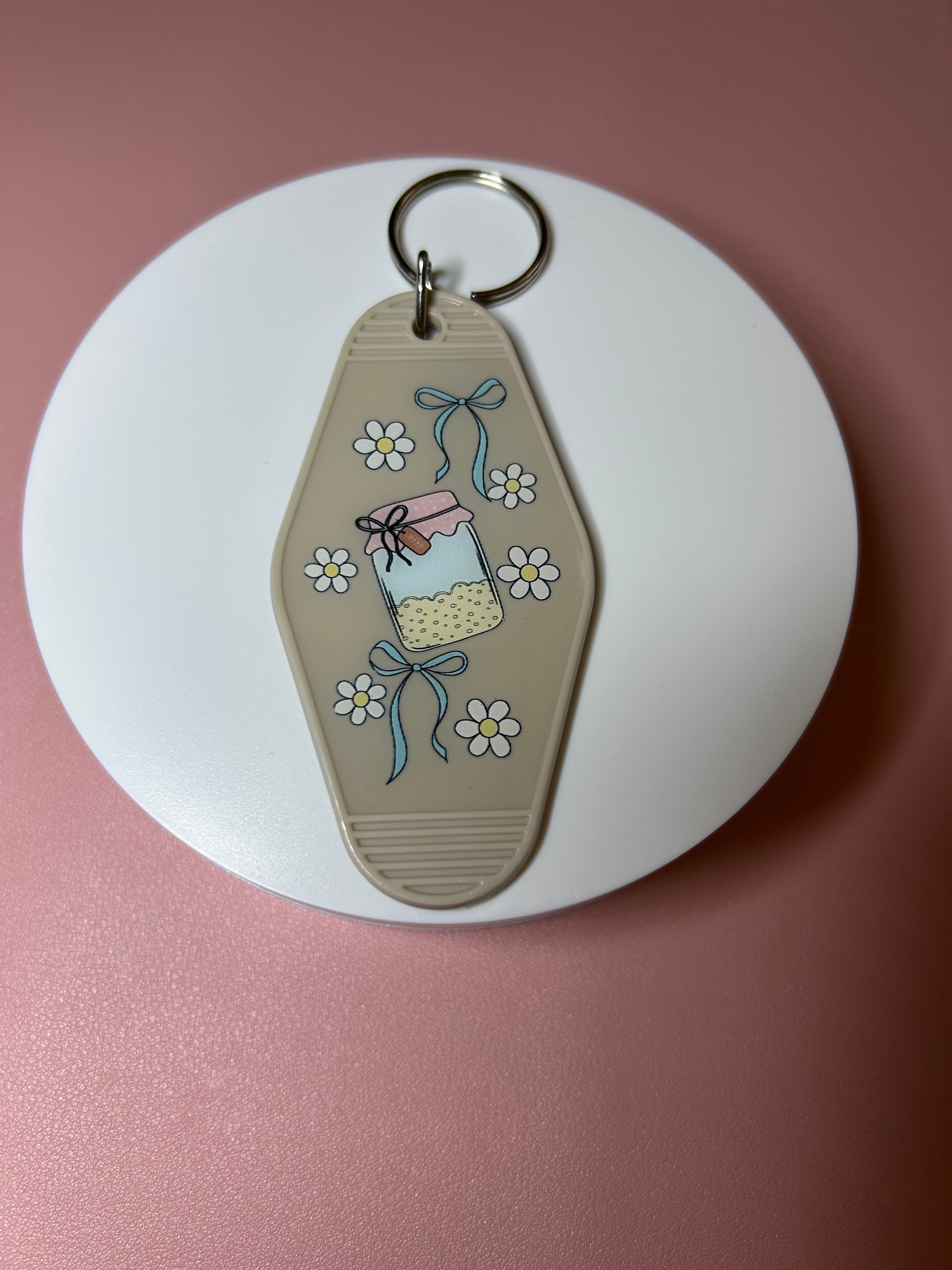 Double sided motel keychain